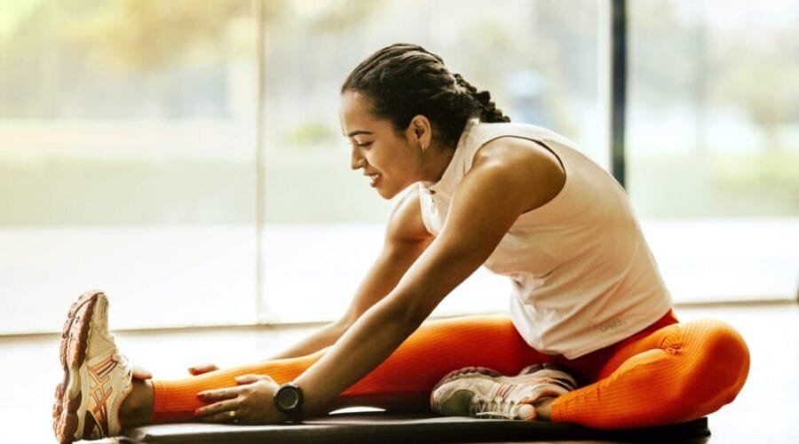 woman stretching on ground