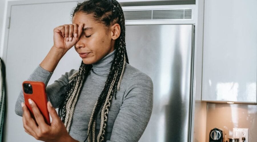 sad young ethnic lady arguing during video call