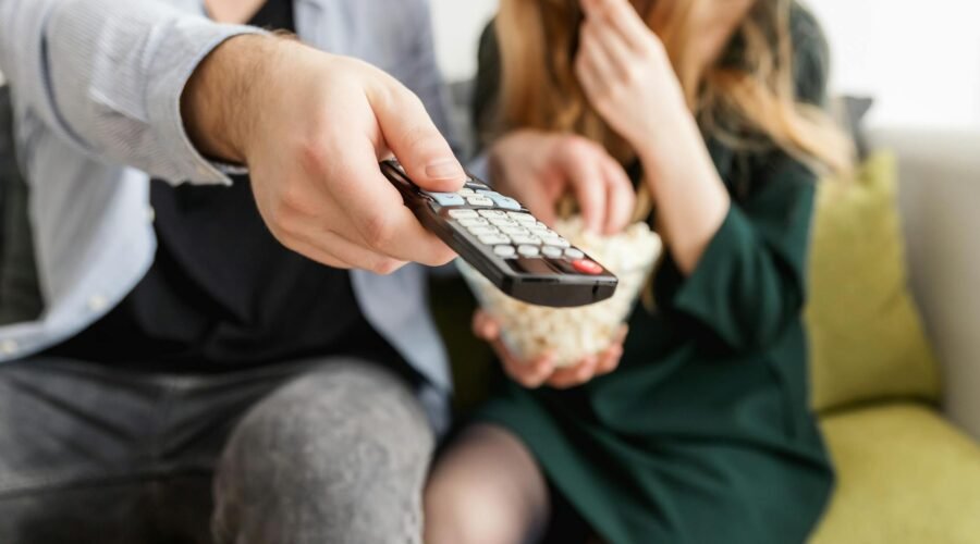 man holding remote control