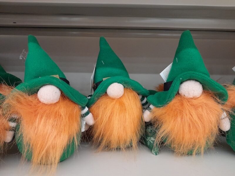 a group of green and orange gnomes sitting next to each other,san patricio, san patricio 2026, st patrick's day